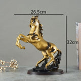 Statue de cheval noir et or