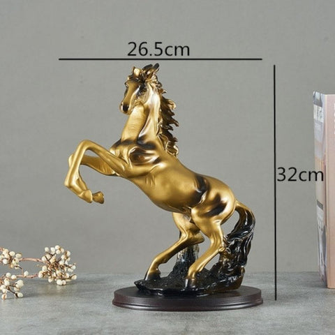 Statue de cheval noir et or