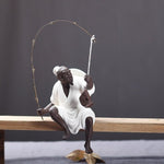 Statue pêcheur blanc