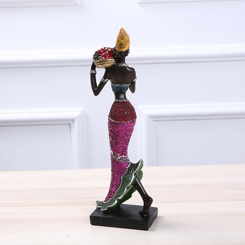 Statue femme africaine avec fruits